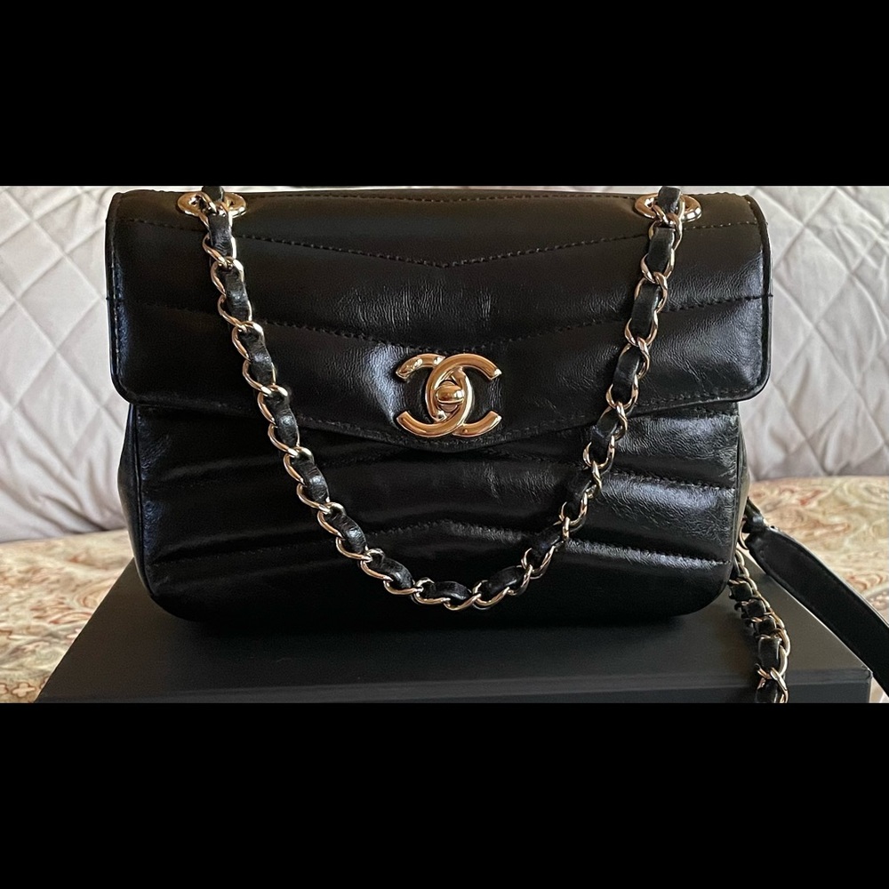 Chanel black color flap back bag